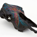 Cow skull with southwest striping